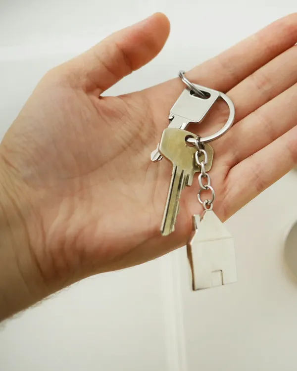 Hand holding a set of house keys